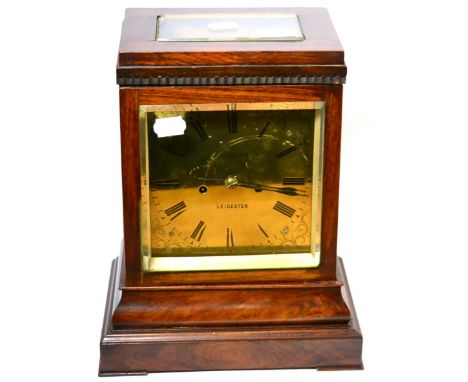 A rosewood striking table clock, 19th century, case with four bevelled glass panels, 7-inch brass dial with Roman numerals in