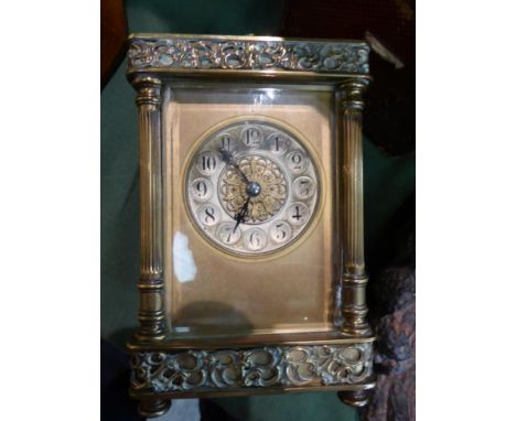 A brass striking and repeating carriage clock, circa 1900, carrying handle and repeat button, pierced borders, silvered Arabi