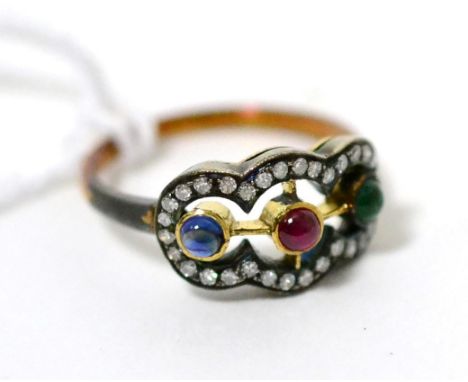 A multi-gemstone and diamond ring, a round cabochon ruby, emerald and sapphire in yellow rubbed over settings within a border