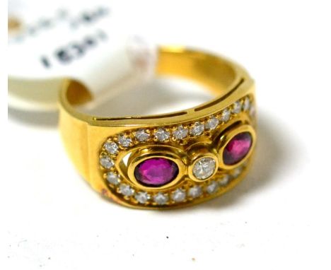 A ruby and diamond ring, a round brilliant cut diamond between oval cut rubies in yellow rubbed over settings, within a pavé 