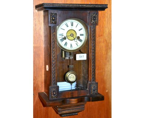 An unusual German small musical wall clock, signed Junghans, circa 1900, carved inset pilasters, enamel dial with Roman numer