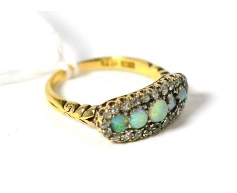 An opal and diamond ring, five graduated round cabochon opals within a border of eight-cut diamonds in white claw settings, t