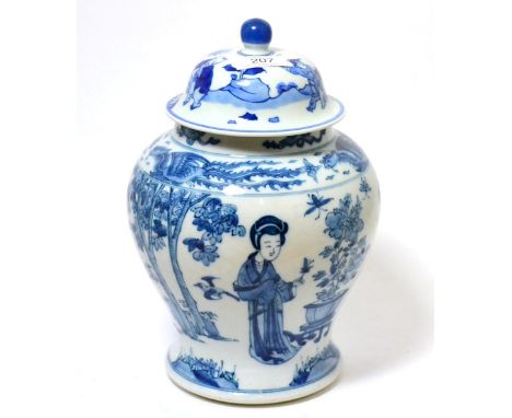 Chinese blue and white jar and cover. in Kangxi style, decorated in underglaze blue with figures in a garden, 31cm high      