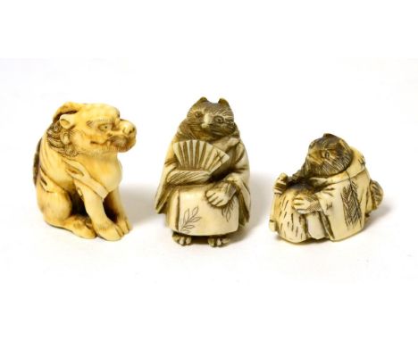 A Japanese carved ivory netsuke as an animal wearing a cloak, 3.5cm; a similar netsuke, 2cm; and an okimono as a seated beast