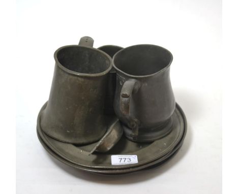 A collection of 18th century pewter comprising three tankards, four plates and a caddy spoon       
