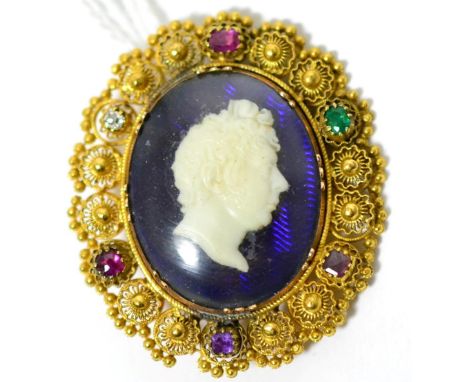 A cameo 'Regard' brooch, a white glass cameo depicting the portrait of a gentleman on an iridescent blue ground, within a can