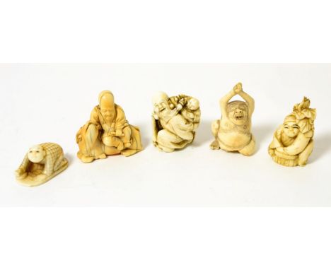 A Japanese netsuke of Fukurokuju, 3.5cm high; a similar netsuke, 4cm high; and three further netsukes, all late 19th/early 20