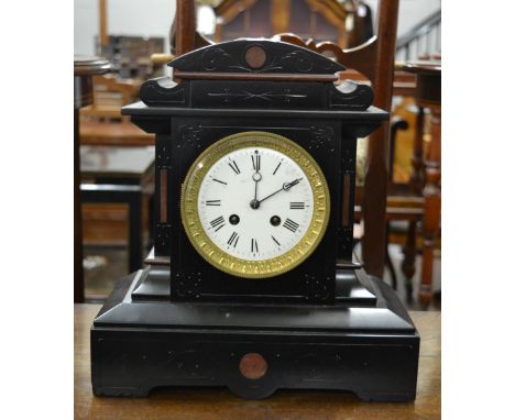A 19th century French striking slate and rouge marble mantel clock or architectural form, the whit enamel dial with Roman num