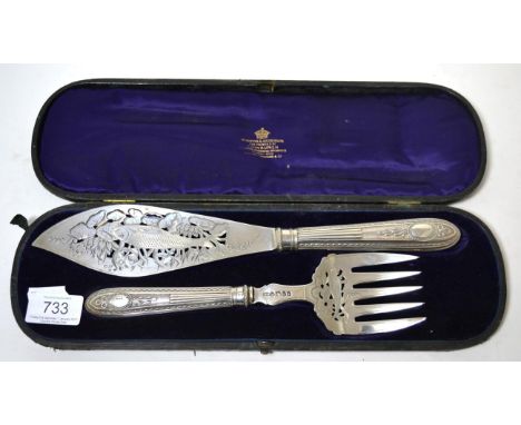 A Victorian silver fish serving set, Sheffield 1871 comprising fork and slice, both finely pierced and engraved with a fish  