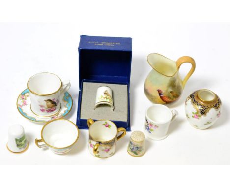 A Royal Worcester porcelain jug, 1913, painted by James Stinton with pheasant, 7cm high; a similar miniature mug painted with
