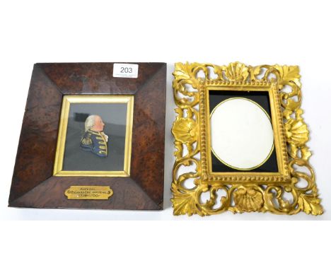A 19th century coloured wax portrait of Admiral Richard G Howe in a yew frame; and a giltwood Florentine style frame with ver