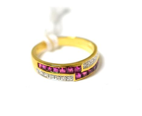 A ruby and diamond ring, two bands of step cut rubies in yellow channel settings between two bands of pavé set eight-cut diam