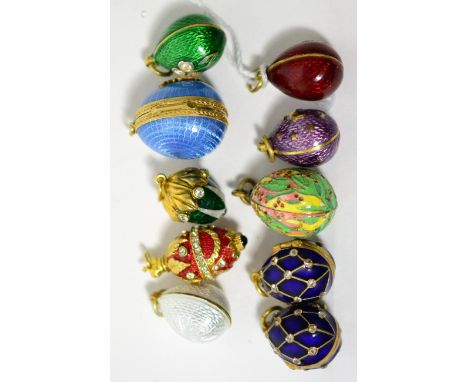 Ten egg charms, enamelled in various colours, some paste set and some hinged to open      Good condition overall. Some minor 
