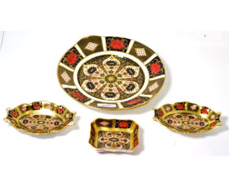 A group of Royal Crown Derby Old Imari pattern wares including four dinner plates, a twin handled dish and three trinket dish