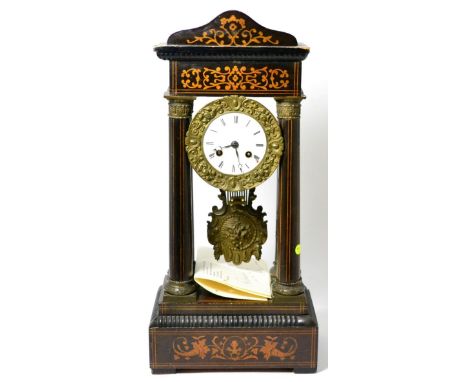 An ebonised inlaid portico clock, circa 1880, portico case with inlaid scroll decoration, enamel dial with Roman numerals, tw