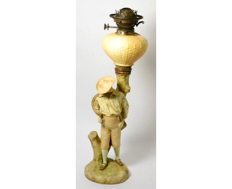 A Royal Worcester blush ivory oil lamp in the form of a farmhand, shape 964, 58cm high      Body of font appears to be extens