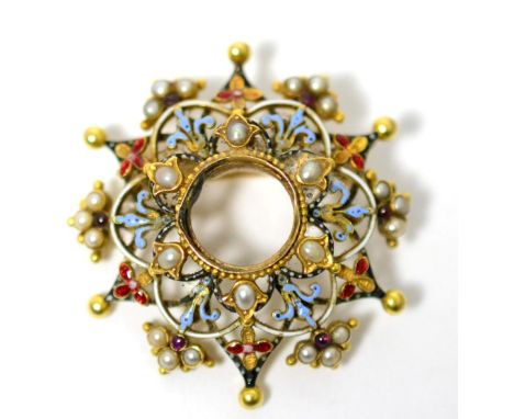 An enamel, seed pearl and garnet set brooch, a vacant circular centre within a border of six seed pearls in yellow leaf motif