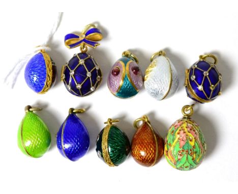 Ten egg charms, enamelled in various colours, some paste set and some hinged to open       Good condition overall. Some minor