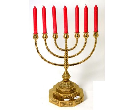 A Jewish brass seven-light candelabrum, with knapper arms and stem, on stepped octagonal base, 40cm high  Provenance: A Priva