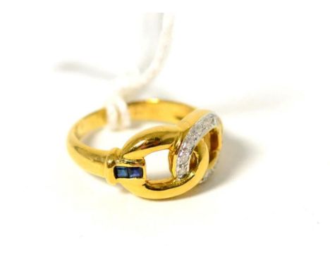 A diamond and sapphire ring, a loop pavé set with round brilliant cut diamonds linked with a yellow loop, to channel set step