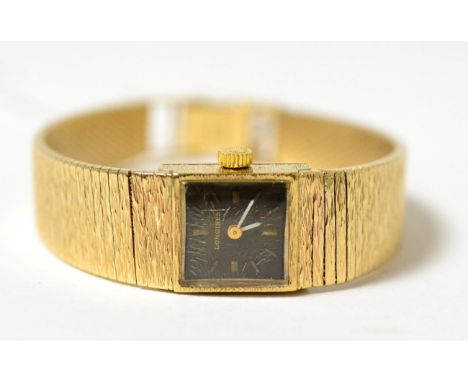 A lady's 9ct gold wristwatch, signed Longines, 1972, (calibre 410) lever movement signed and numbered 51329189, black dial wi
