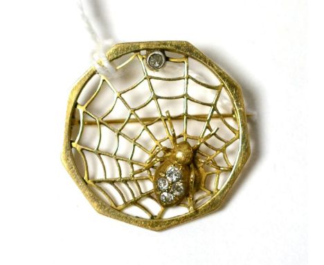 A diamond set spider and web brooch, a yellow spider with an abdomen inset with four old cut diamonds, within a web set with 
