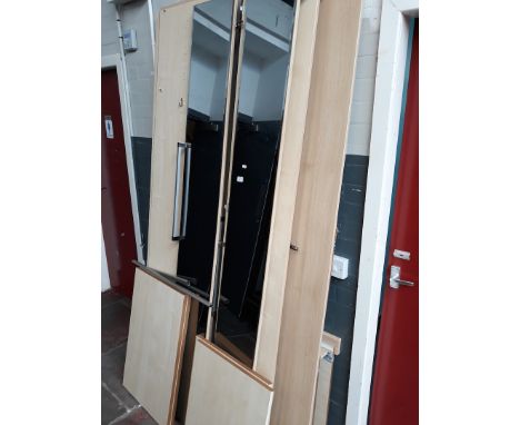 A LIGHT WOOD EFFECT MIRRORED WARDROBE