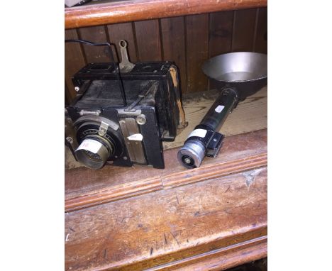 A PLATE VANNECK CAMERA AND FLASH GUN