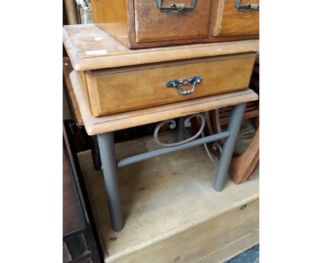 A LIGHT WOOD AND METAL SIDE TABLE