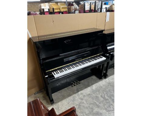 Yamaha (c1987) A 131cm Model U30BL upright piano in a traditional bright ebonised case.  There is VAT on this lot. A conditio
