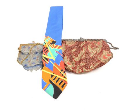 A small purse with silver frame, Birmingham 1904, scroll, mask and bird design to one side; beaded evening purseLiberty of Lo
