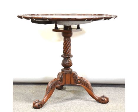Reproduction mahogany Chippendale style tripod table, circular tilt-top with moulded pie-crust edge, leaf-capped and spiral t