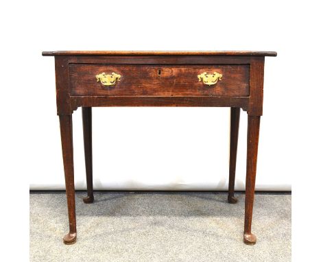 Joined oak side table, boarded top with cleated sides, frieze drawer, turned legs on pad feet, width 82cm, depth 52cm, height