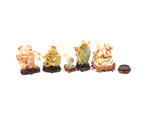 Five intricately carved modern jade vases with covers depicting boughs, flowers and birds, 13-15cm; a cream and brown dish ca