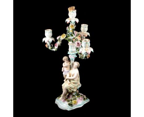 Large Dresden porcelain four-light figural candelabra, the floral encrusted arms supported on a stem modelled as a woman with