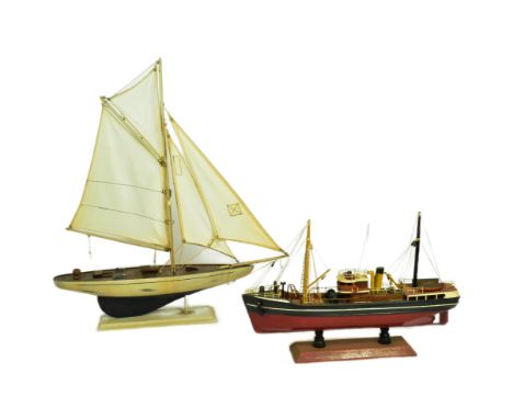 Two vintage hand made scratch built model boats comprising a pond yacht with white sails and a steam liner. Both fixed to bas