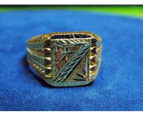 UNMARKED YELLOW  METAL SIGNET RING WITH FEATHER CUT SHOULDERS AND A SQUARE PLATFORM WITH HORIZONTAL AND BLAZE CUT DECORATION 
