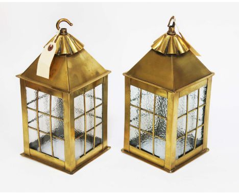 A pair of brass hanging lantern type light fittings, height 29cm.All glass is intact with no damage