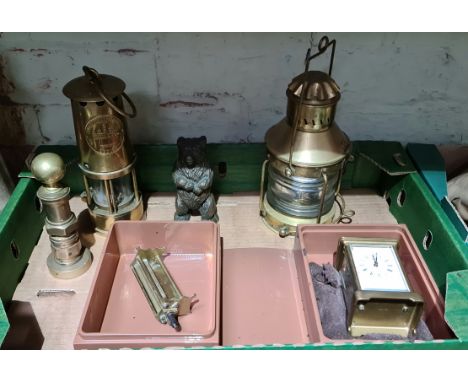 A box of various metalware to include a brass ships lantern, an Eccles type 6 miners lamp, a cast bear money bank and a Matth