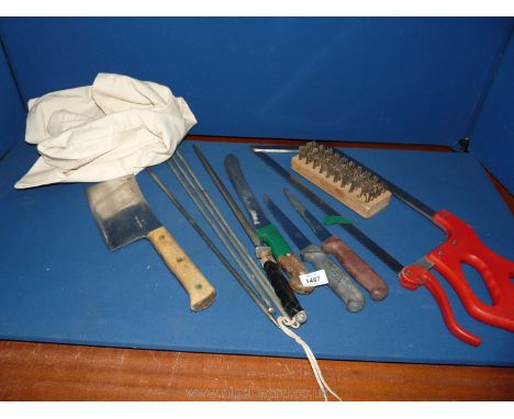 A canvas bag containing Butchers tools including knife, stainless steel cleaver, stainless bladed spur, four large shelves an