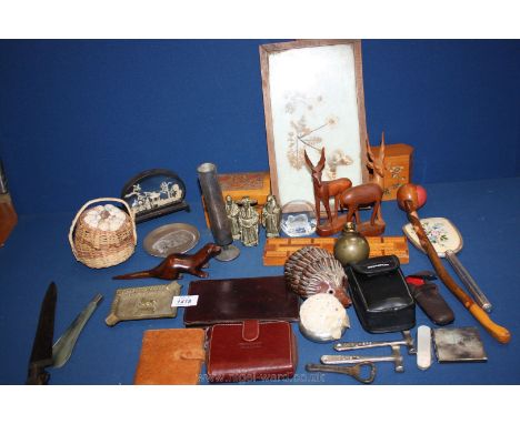 A box of miscellanea including a small cork picture, a wooden cribbage board, a wooden otter, pipe and deer etc.