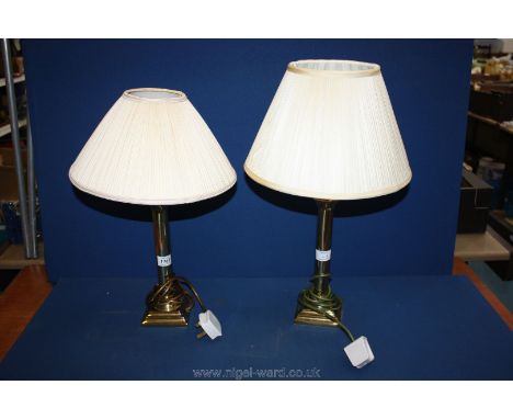 Two brass Lamp bases (tall) with cream pleated shades.