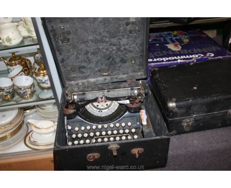 A typewriter, cased.