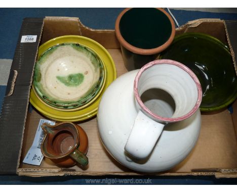 A box of pottery including large white vase with handle, small green/brown jug, two light green bowls, etc.