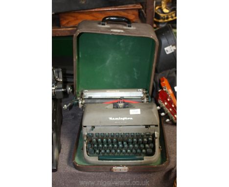 A vintage portable Remington Quiet-writer Typewriter.
