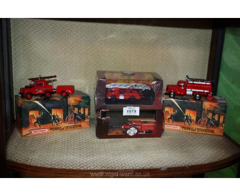 A Matchbox fire engine boxed, a boxed Matchbox works fire service Landrover and tender, and another fire engine.