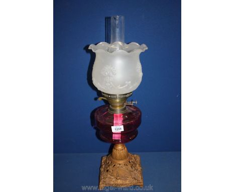 A ruby glass oil Lamp.