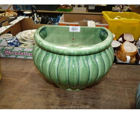 A green china wall planter.