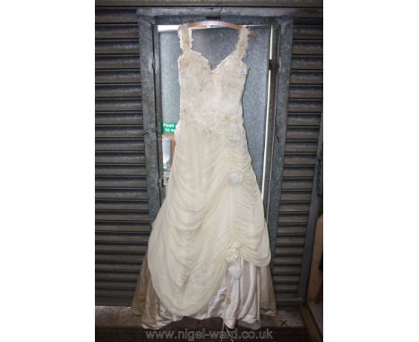 A Catherine Davighi, size 12 cream satin Wedding Gown, with boned bodice overlaid in fine lace and lightly beaded, georgette 