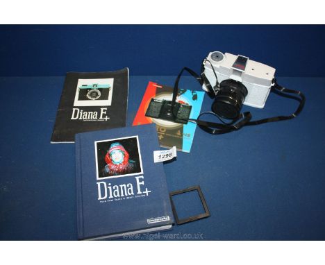 A Diana FX Lomo Camera with instruction manual and book.